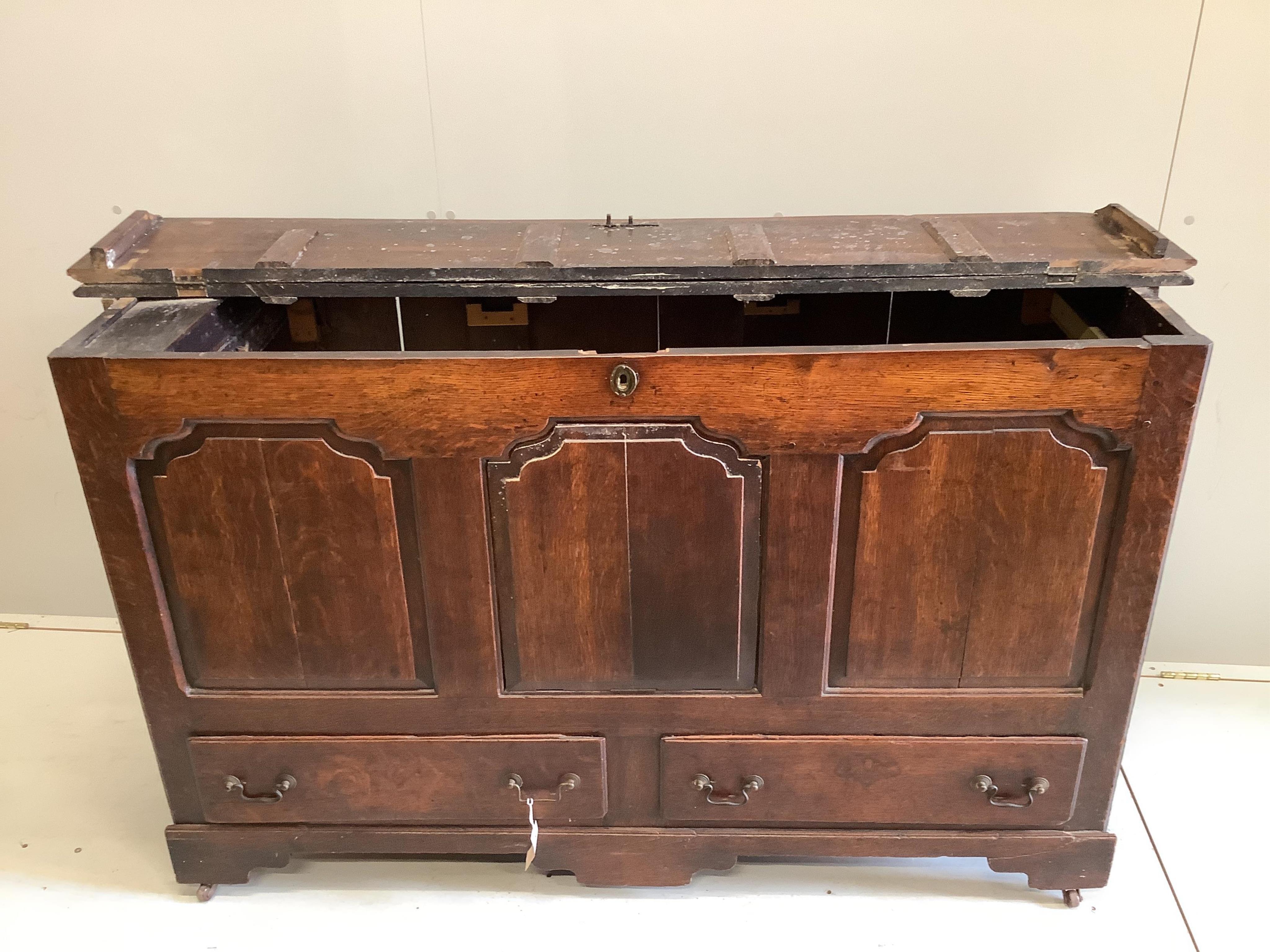 An 18th century panelled oak mule chest, adapted, width 152cm, depth 54cm, height 92cm